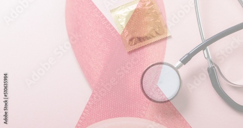 Multiple exposure of red ribbon with condom and stethoscope, copy space