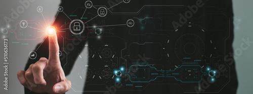 Fotografie Cyber security and futuristic technology concept businessman using finger to tou