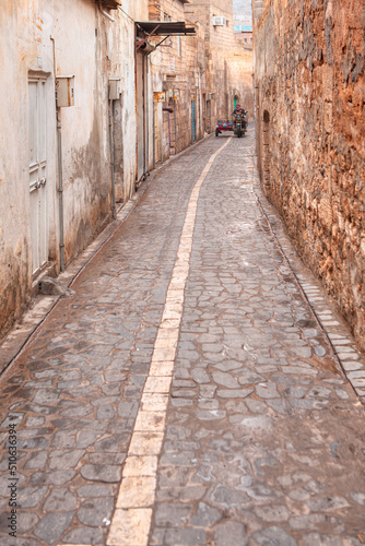 Narrow streets and alleys in the old city of urfa with a motorcycle in the background - Urfa  Turkey