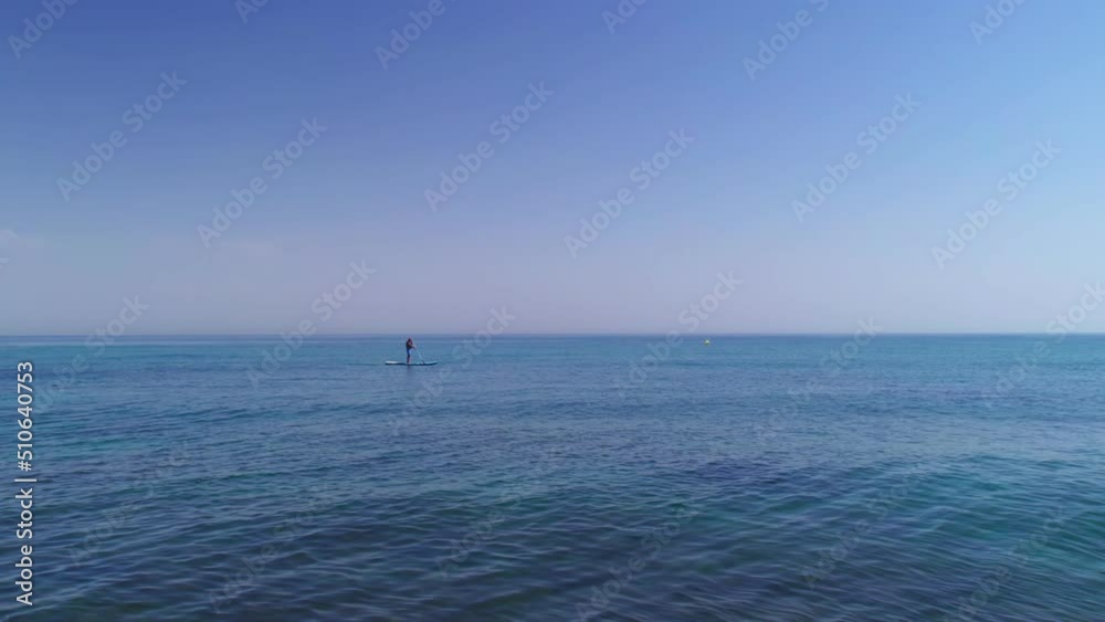 Adult on a Stand Up Paddle Board Adult on a Stand Up Paddle Board