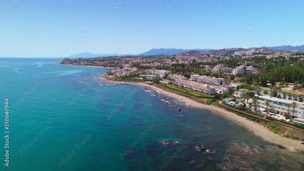 Drone flying along the coastline of Calahonda on a clear day, south of Spain Drone flying along the coastline of Calahonda on a clear day, south of Spain
