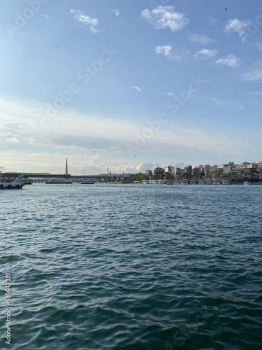 "Istanbul, Turkey": Galata Bridge with the view of İstanbul Bosphorus. Famous location for tourists. © Malvina