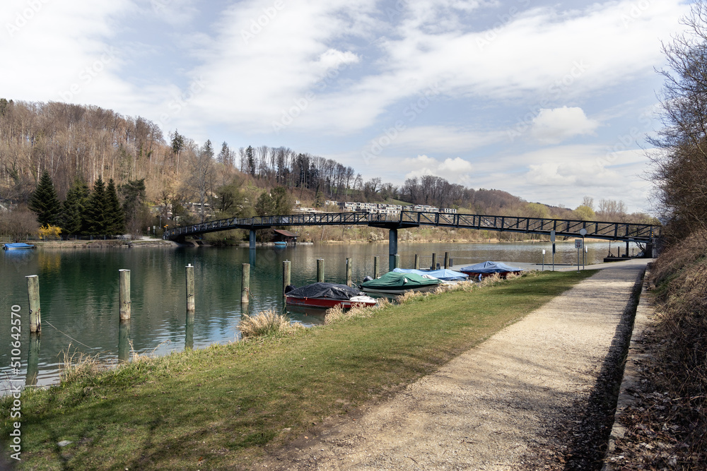 River landscape with boats and bridge