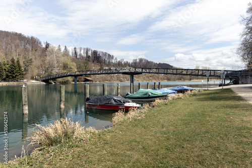 Boats moored on the river with a view of the bridge