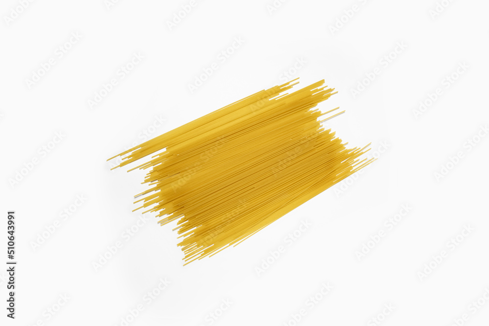 Raw long spaghetti on a white background. Top view, flat lay. Raw long spaghetti on a white background. Top view, flat lay.