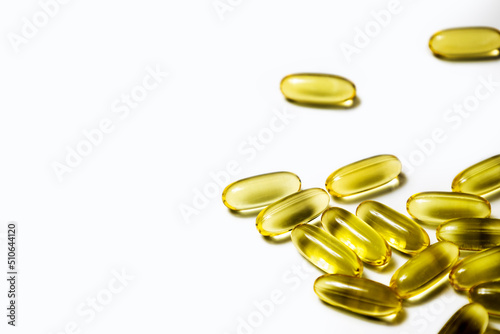 Vitamins in capsules fish oil, omega 3 and vitamin D on a white background.