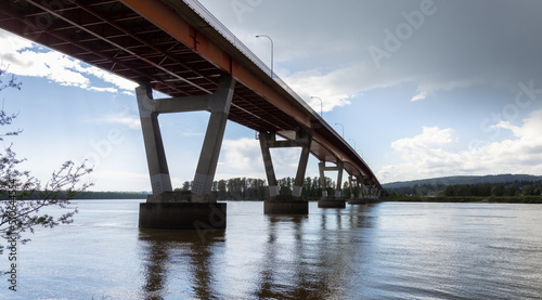 Mission Bridge over Fraser River during Sunny and Cloudy Spring Season Day. Fraser Valley  British Columbia  Canada.
