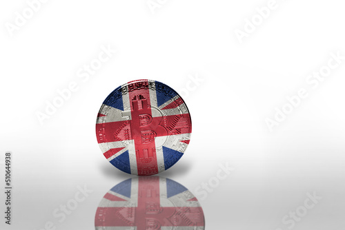 bitcoin with the national flag of great britain on the white background. bitcoin mining concept. photo