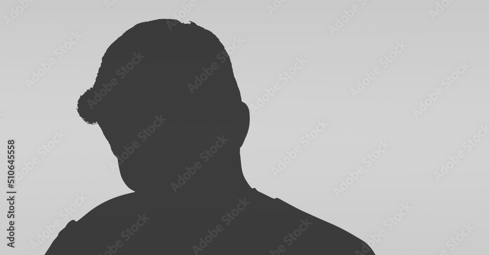Dark silhouette of a man against copy space on grey background