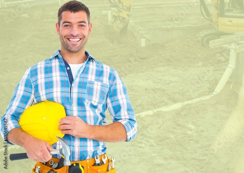 Composite image of male construction worker against blurred background with copy space