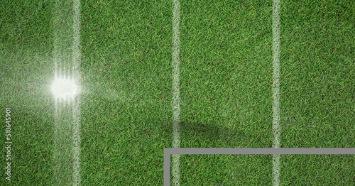 Composite image of spot of light and top shot of grass field with copy space