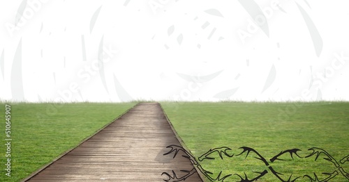 Composite image of pathway through grass field against copy space on white background