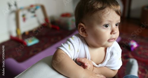 Cute baby boy infant standing up at home