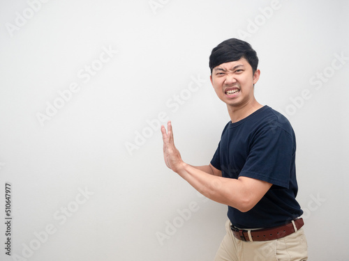 Young man gesture heavy push isolated