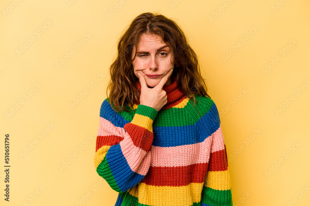 Young caucasian woman isolated on yellow background contemplating, planning a strategy, thinking about the way of a business. Young caucasian woman isolated on yellow background contemplating, planning a strategy, thinking about the way of a business.