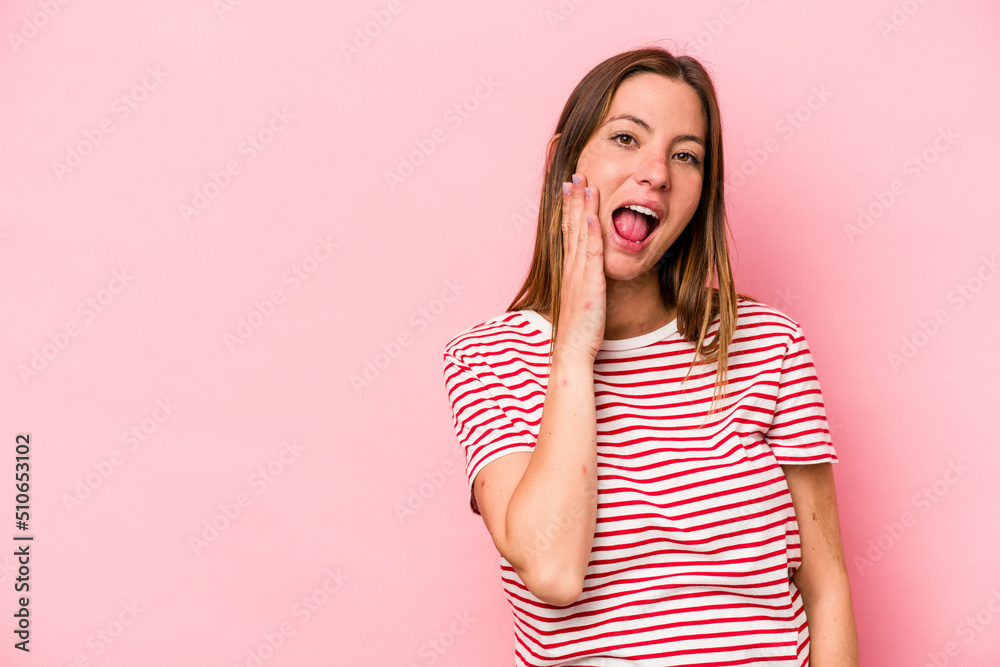 Young caucasian pregnant woman isolated on white background shouts loud, keeps eyes opened and hands tense. Young caucasian pregnant woman isolated on white background shouts loud, keeps eyes opened and hands tense.