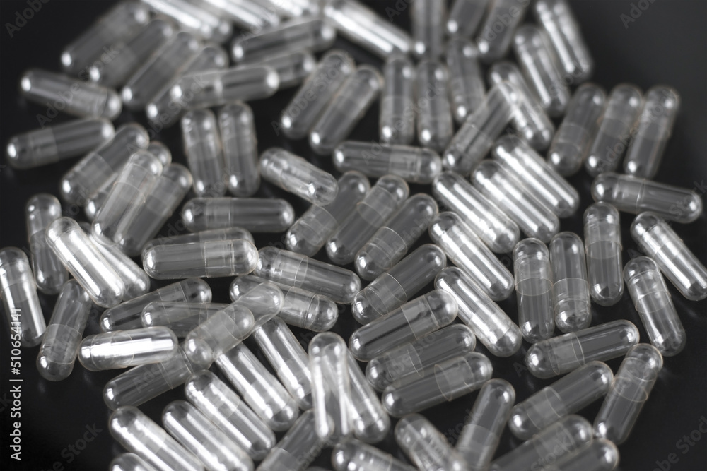 Blank Transparent Capsules on a Black Background Blank Transparent Capsules on a Black Background