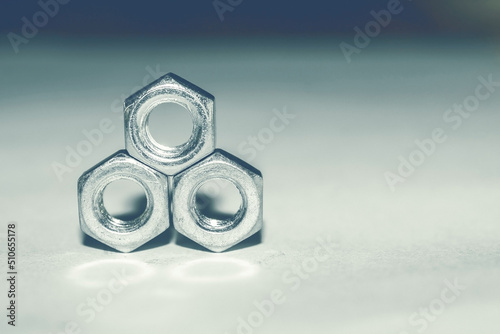Metal figure of nuts. Balance nuts. Round nuts for work