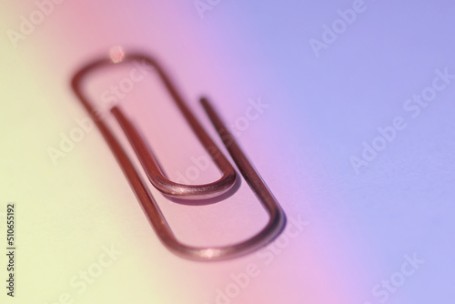 Paper clip on a white background. Design tool. Stationery tool