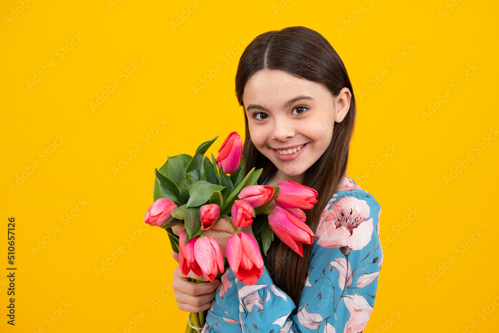 Positive child with tulips, mothers or womens day. Kid hold flowers for 8 of march. Teen girl with spring bouquet. Positive child with tulips, mothers or womens day. Kid hold flowers for 8 of march. Teen girl with spring bouquet.