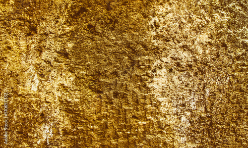 Precious Foil. Rough structure mineral. Rock texture.Gold texture. Golden Ore rocks. Stone background. Abstract texture. Rock pile. Stone texture. Structure. Shimmering surface.