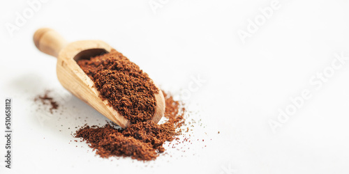 Diet drink chicory in a cup - coffee substitutes, powder and flowers on the white background. photo