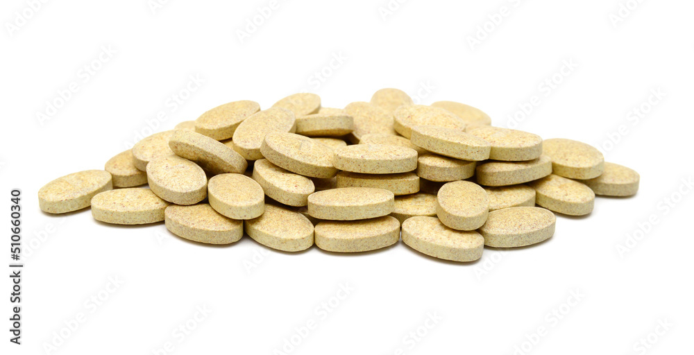Brown pills, medicine isolated on white background, top view Brown pills, medicine isolated on white background, top view