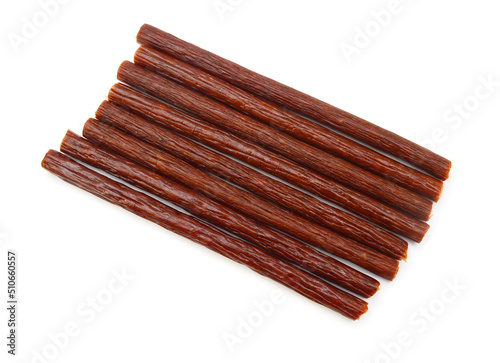 Smoked stick sausages, isolated on white