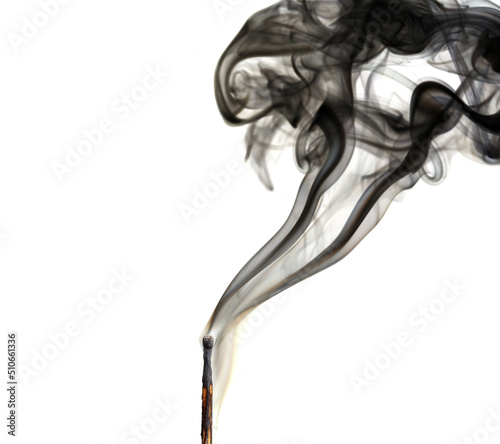 Match with smoke. Smoke coming from a half-burnt match on a white background close-up.