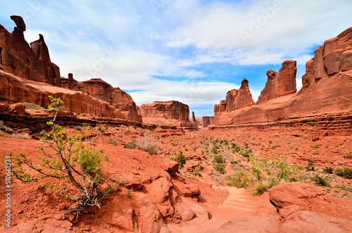 Soaring red rock walls of Park Avenue in Arches National Park, Utah, USA