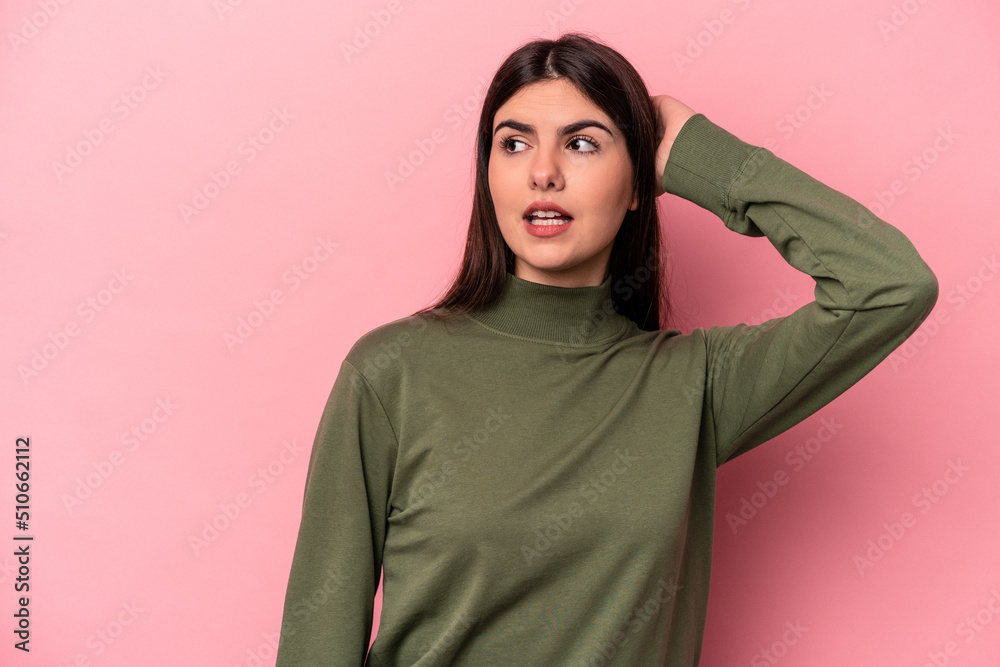 Fototapeta premium Young caucasian woman isolated on pink background being shocked, she has remembered important meeting.
