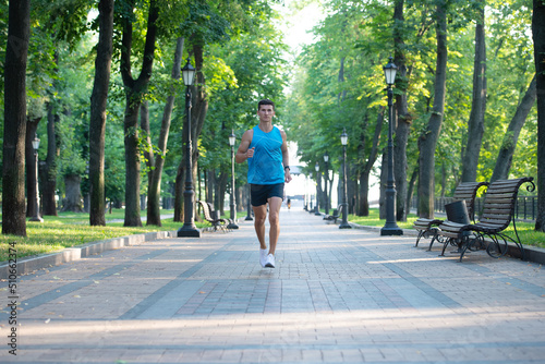 athletic man runner running in sportswear outdoor. distance running