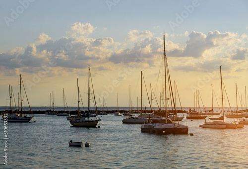 Many beautiful moored sail yachts on water summertime vacation luxury lifestyle © ungvar