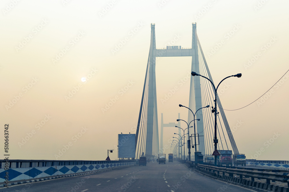 Fototapeta premium Vidyasagar Setu (Bridge) over river Ganges, 2nd Hooghly Bridge in Kolkata,West Bengal,India. Shot in winter morning. Connects Howrah and Kolkata, Longest Cable - stayed bridge in India.