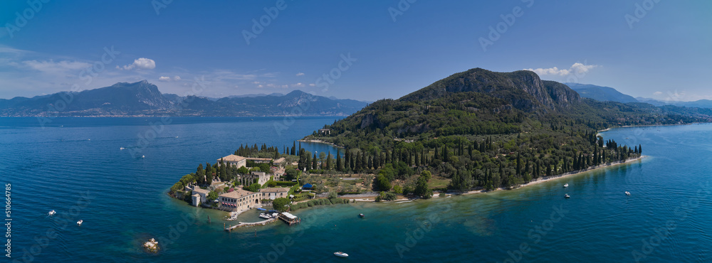 Aerial panorama of Parco San Vigilio, Lake Garda, Italy. Aerial view of Punta San Vigilio, Garda. Top view of Baia delle Sirene Park.