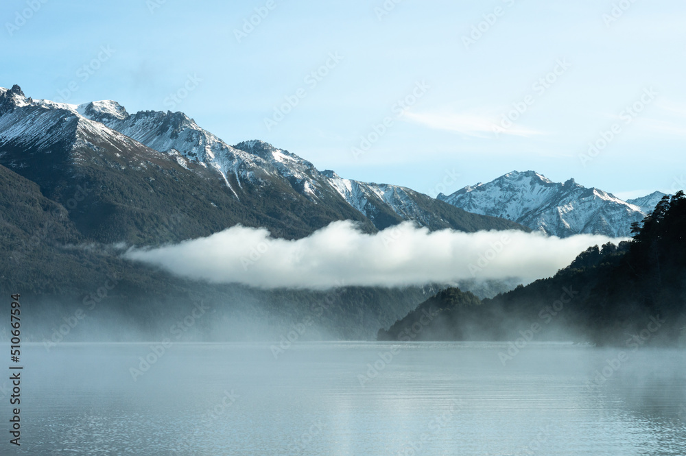 Beautiful low cloud crossing between mountains of the Andes mountain range. Lake Gutierrez, Los Alerces National Park
