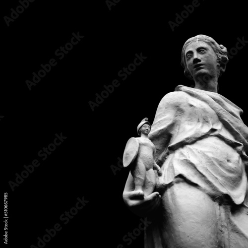 Goddess of wisdom and victory Athena. She holds the winner's warrior in her hand. Black and white image. Copy space for text or design. photo