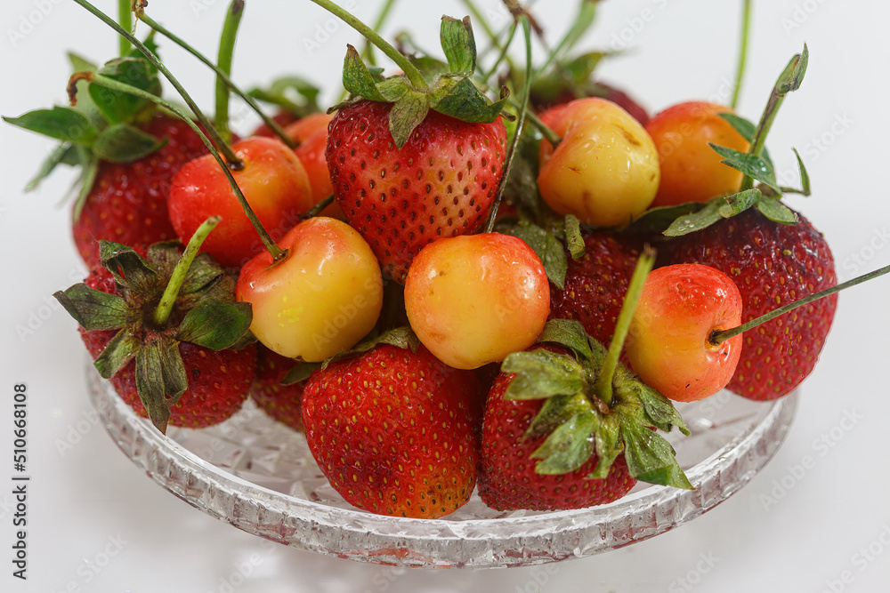 Strawberries with cherries on a white background Strawberries with cherries on a white background