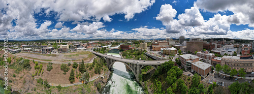 Panorama view of Spokane, WA cityscape with view of Monroe St Bridge and Spokane River during the day, United States