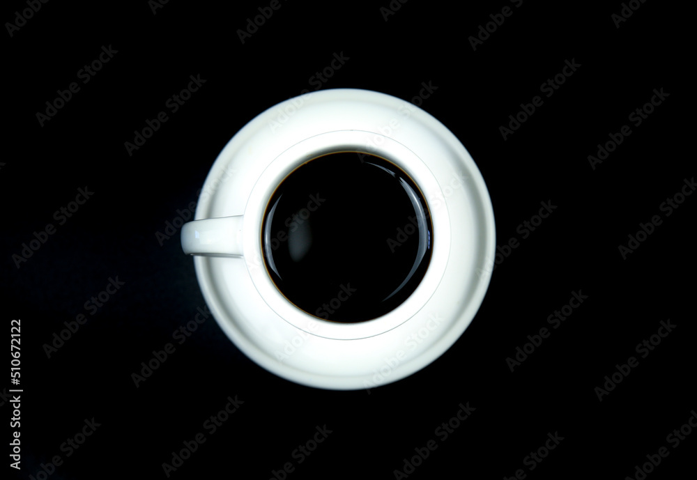 White cup of coffee on black background White cup of coffee on black background