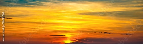 colorful sunset illuminating the sky yellow and red