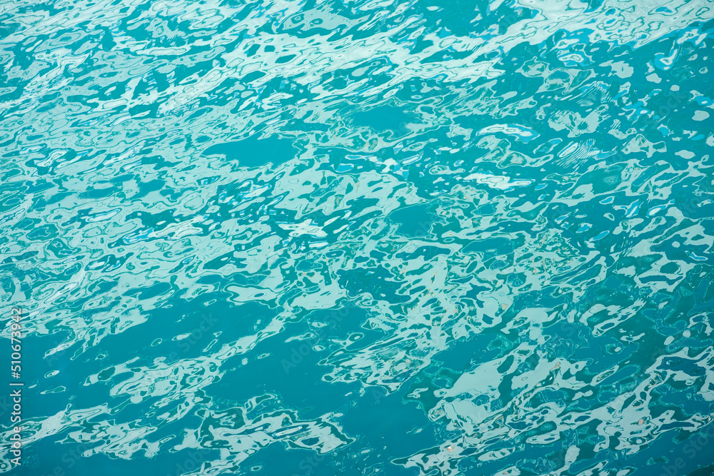 Beautiful reflection in turquoise sea water background