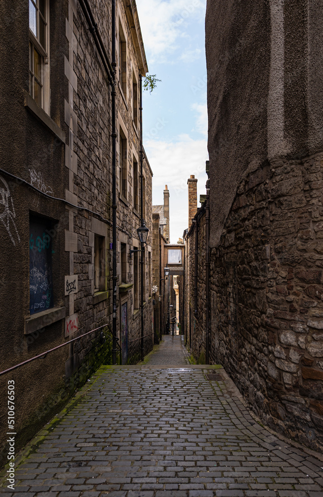 View of Edinburgh from an alley located in the old town View of Edinburgh from an alley located in the old town