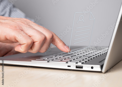 CV, application submission. Man working on laptop and sending curriculum vitae. Male forefinger pressing enter button. Resume uploading concept. High quality photo photo
