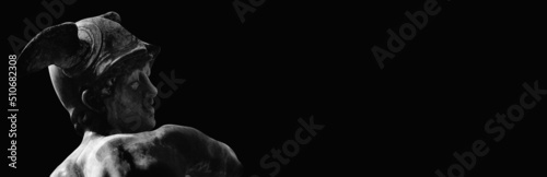 Fotografie Ancient statue of the antique god of commerce, merchants and travelers Hermes (Mercury) on black background