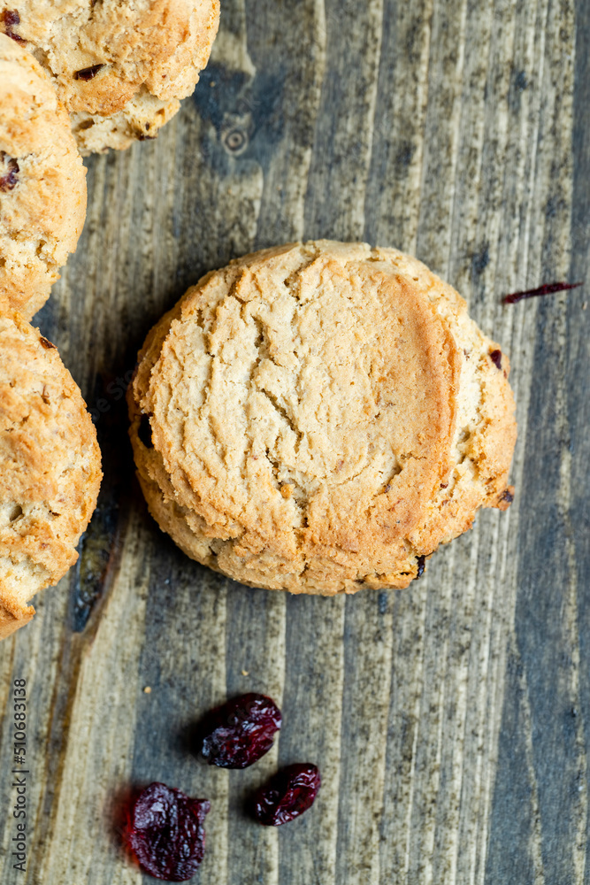 delicious dried cookies made of high-quality flour with dried red cranberries on the table
