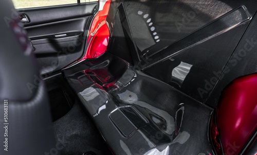 Rear seat delete replaced with carbon fiber in a four door car © Brandon Woyshnis