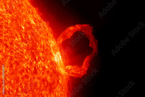 Flash in the sun, on a dark background. Elements of this image furnished by NASA photo