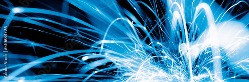 blue sparks in the dark. lines of light.