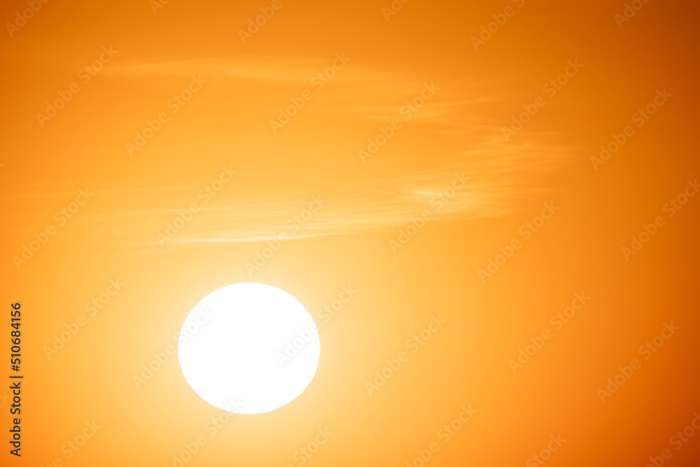 Gorgeous panorama scenic of the strong sunrise with silver lining and cloud on the orange sky. High quality photo